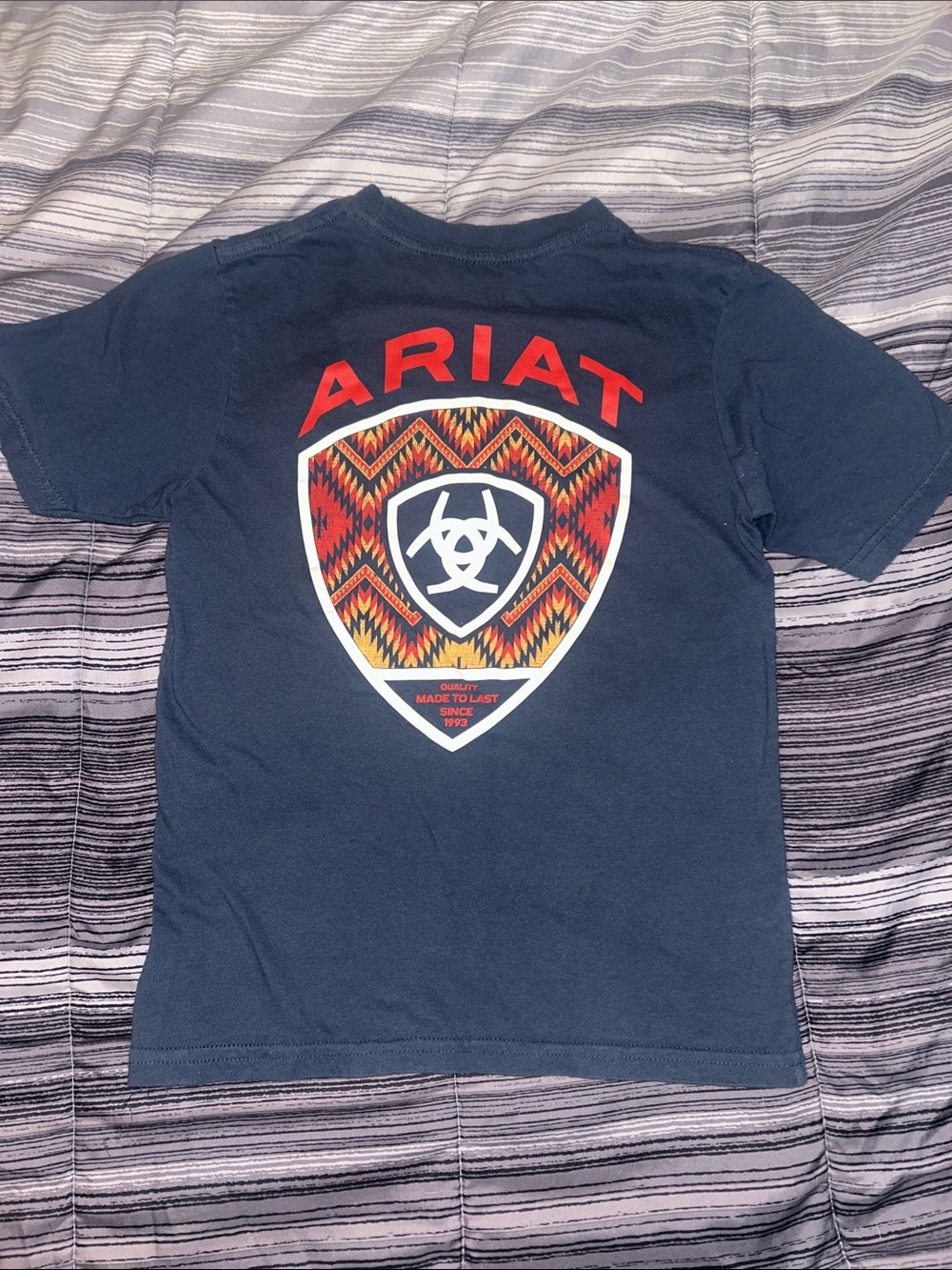 Buckle Ariat Kids Navy Tee with Red & Orange Shield Graphic